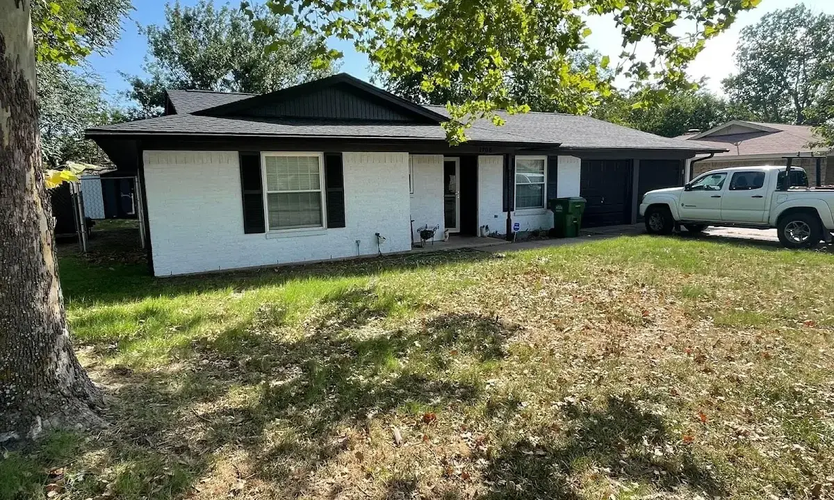 Professional roofing crew working on a residential roof in Tallahassee